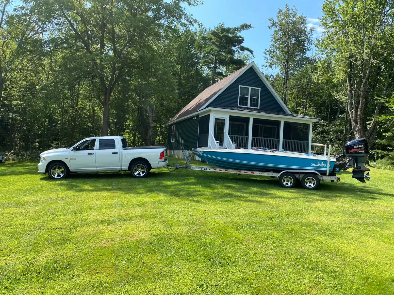 Launching a boat from the lakeside lawn