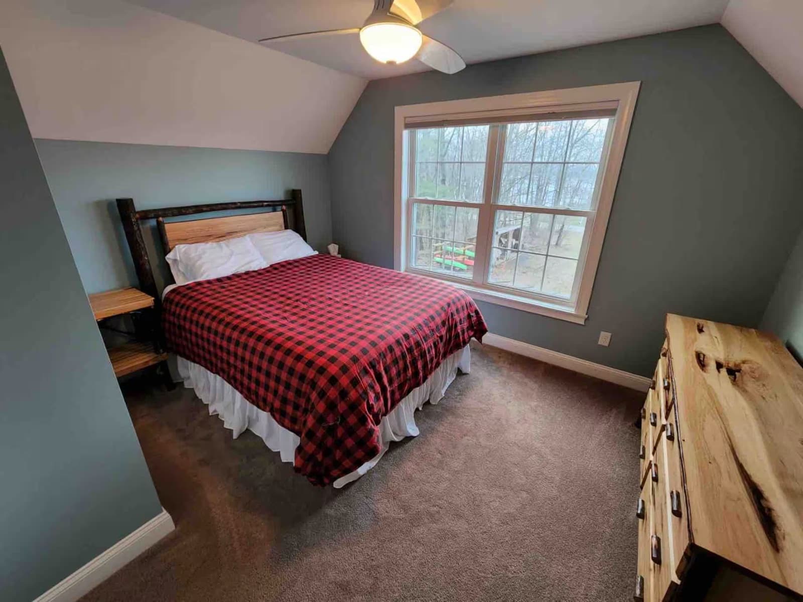 Upstairs bedroom with a window on the lake